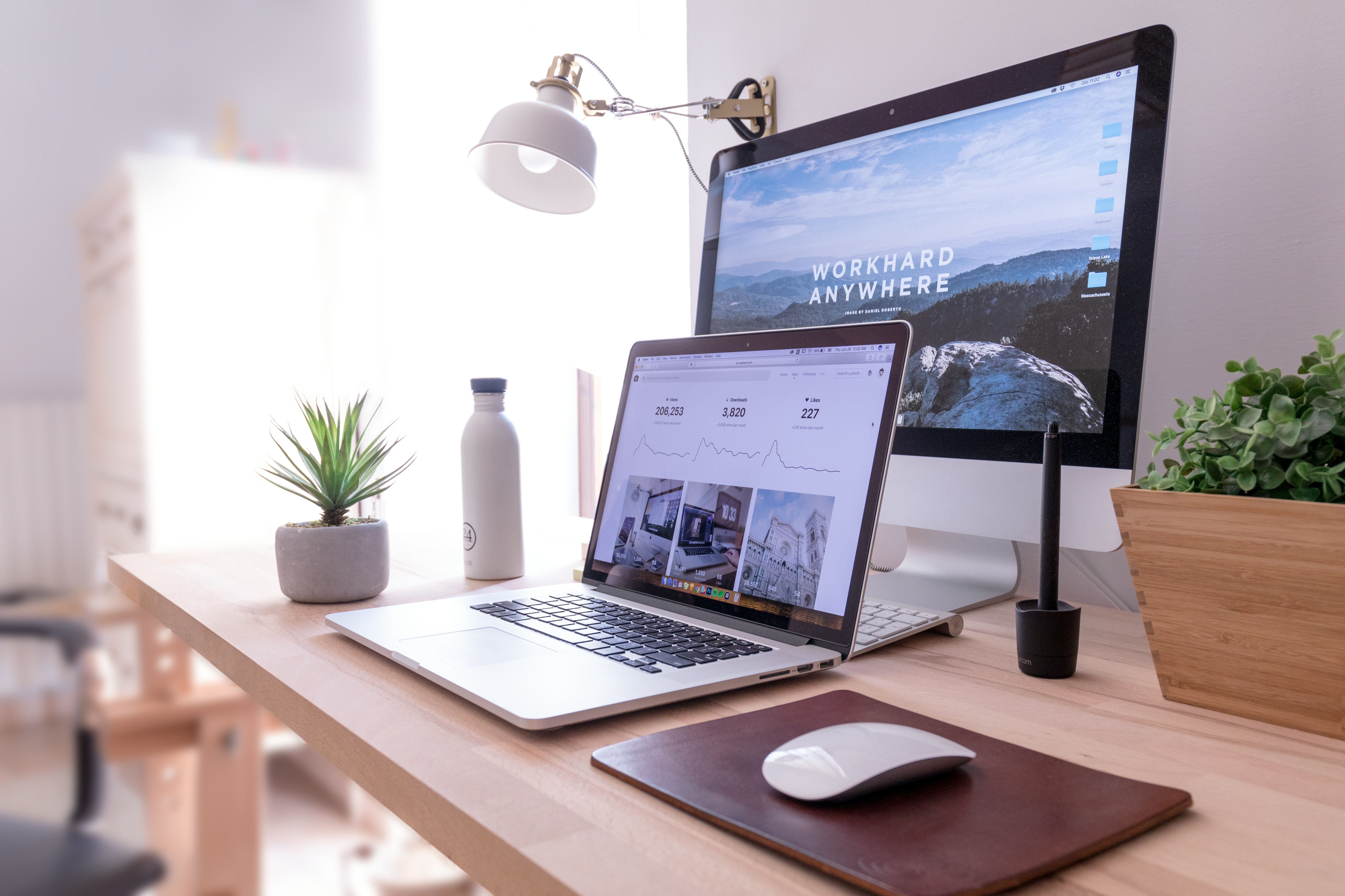 Laptop displaying a modern small business website beside a coffee cup
